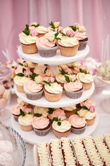 candy bar decorated by delicious sweet buffet with cupcakes and other desserts/candies , happy birthday concept