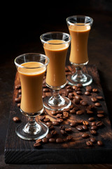 Irish cream coffee liqueur in glass, selective focus