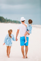 Father and kids enjoying beach summer vacation