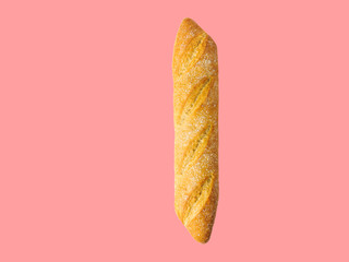 Freshly baked artisan whole baguette with golden crusty floury texture on pink background. Poster banner for bakery restaurant cafe. Bread making concept