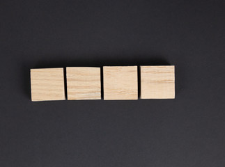 4 Oak Wood squares with no letters on black background
