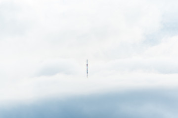 cell tower in the mountains above the clouds lighthouse minimalist concept empty space text ad