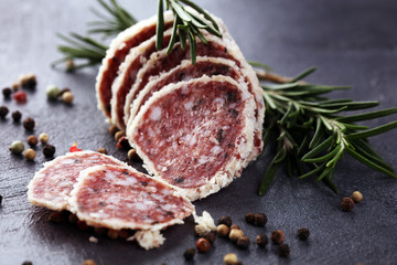 Salami truffle. The saltufo is a piece of salami mixed with summer truffle and parmesan on table