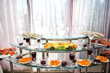 holiday buffet table served by different canape, sandwiches, snacks ready for eating in restaurant