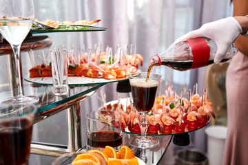 holiday buffet table served by different canape, sandwiches, snacks ready for eating in restaurant