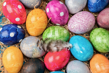 Different easter eggs with straw