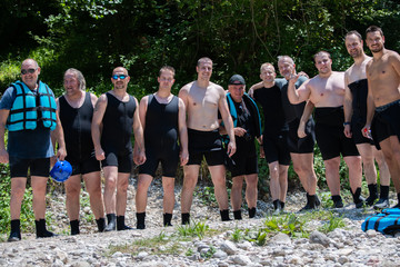 Rafting team on the pause. Enjoying on the sunny day.