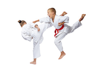 On a white background sportsmens are beating blows karate