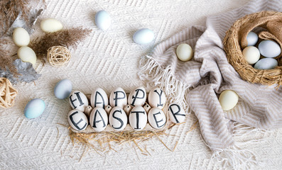 Fototapeta na wymiar Easter eggs with the inscription happy Easter, holiday decor .
