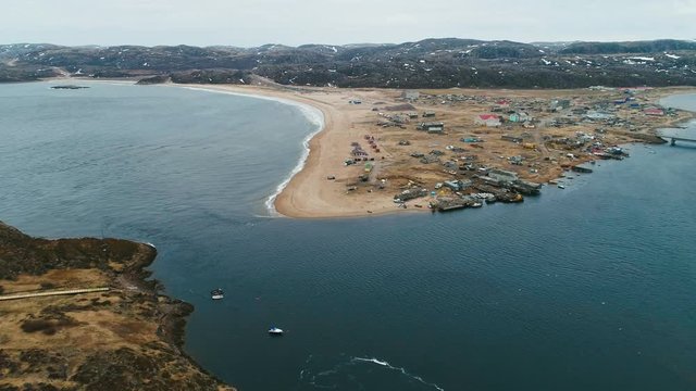 RUSSIA, KOLA PENINSULA, MURMANSK AREA, TERIBERKA VILLAGE &ndash; drone zooming out the north sea coast, drone fly over teriberka