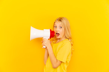 Kid shouting through vintage megaphone. Communication concept. Blue sky background as copy space for your text. - Powered by Adobe
