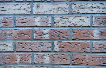 large brown and gray bricks with notches