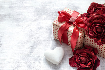Holiday background with a gift with a heart.