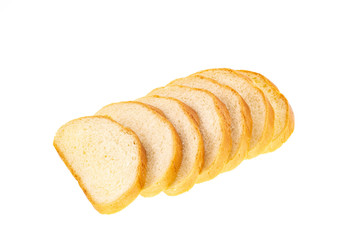 Sliced loaf highlighted on a white background. White bread closeup isolated. Whole bread.Horizontal frame. Studio