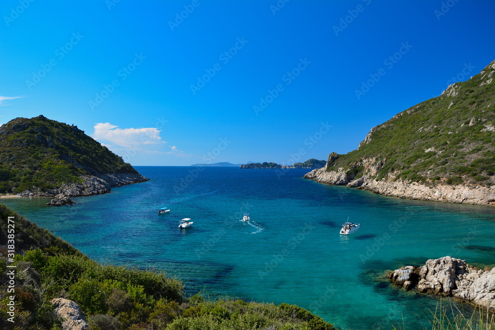 Wall mural boats on a beautiful double beach porto timoni,afionas,corfu,greece,september 2018.