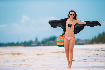 Young beautiful woman on the beach vacation