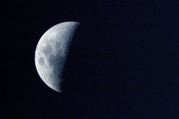 The moon is in a declining phase. On a dark background. Elements of this image were furnished by NASA.