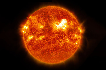 The sun, a hot star, completely. On a dark background. Elements of this image were furnished by...