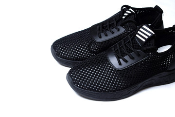 Black sneakers on white background. Classic sport shoes.