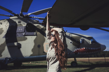 Obraz na płótnie Canvas Fashion brunette model girl wearing military style and sunglasses.