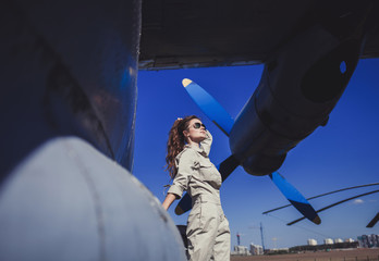 sunny fashion portrait of pretty young brunette woman wearing sunglasses