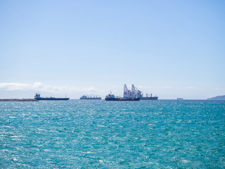 Bay with yachts and ships off the coast of Spain