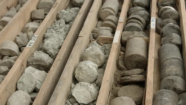 Rock core samples from drilled borehole in wooden box