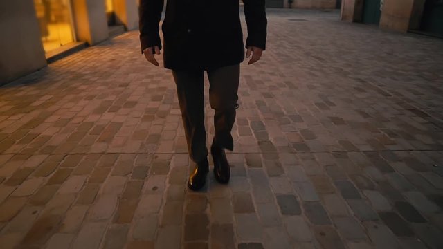 Old Fashion Man from the 1920s england walking along an old street of a historic city