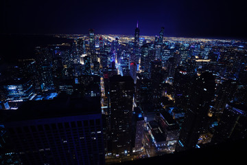 Night wide skyline panorama of Chicago city with illuminations downtown skyscrapers and streets,...