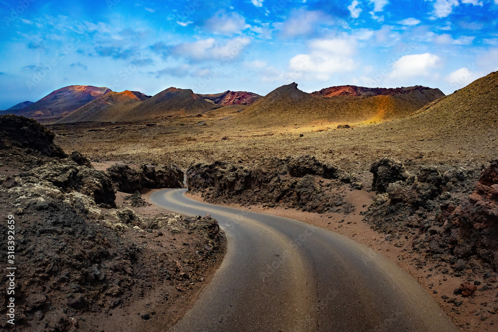 Canvas Prints image related to unexplored road journeys and adventures.road through the scenic landscape to the de