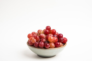 Red Grapes In Small Round Ceramic Bowl