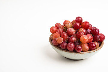 Red Grapes In Small Round Ceramic Bowl