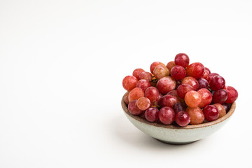 Red Grapes In Small Round Ceramic Bowl