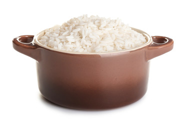 Pot with boiled rice on white background