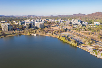 Panoramic aerial view of Canberra City looking north over Lake Burley Griffin with the Ovolo Nishi building, NewActon South Building and BreakFree Capital Tower 