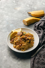 Fufu de platano verde maduro, tacaho, Mofongo, mashed  boiled plantains with porc meat, onion. Puerto Rico.  Amazonian cuisine, Peru, Cuba