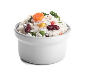 Boiled rice with vegetables in bowl on white background