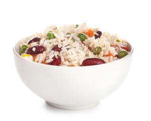 Boiled rice with vegetables in bowl on white background