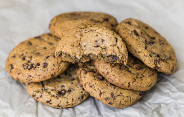 Freshly Baked Chocolate Cookies on Baking Paper. Sweet Biscuits. Homemade pastry.