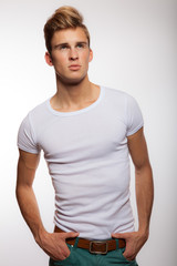 Handsome young elegant man studio portrait.