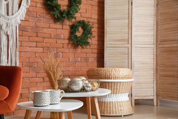 Stylish interior of living room with Christmas decor