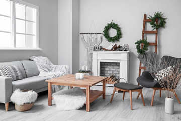 Stylish interior of living room with Christmas decor