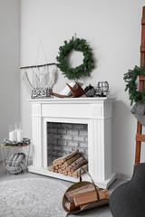 Fireplace with Christmas decor in stylish living room