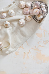 Basket with fresh garlic on white background