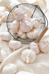 Basket with fresh garlic on table