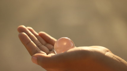 hand holding an marble
