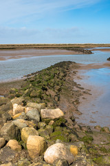Views of mudflat at low tide, Barnham Overy Staithe, Norfolk, UK.