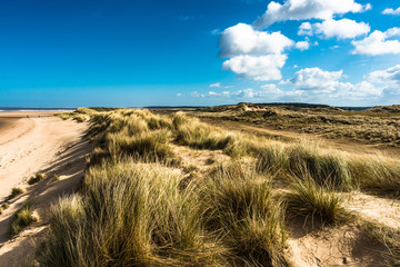 Sand dunes where Norfolk Coast path National Trail from Barnham Overy Staithe reaches the sea