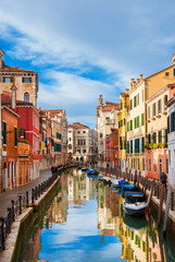 View of Rio Marin, a characteristic Venice canal with old traditional and colorful houses in the quiet Santa Croce District