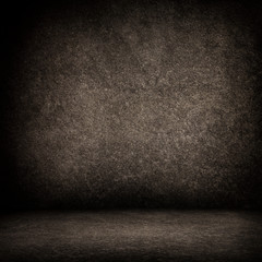 Grunge interior room with concrete wall and floor. Empty concrete space.